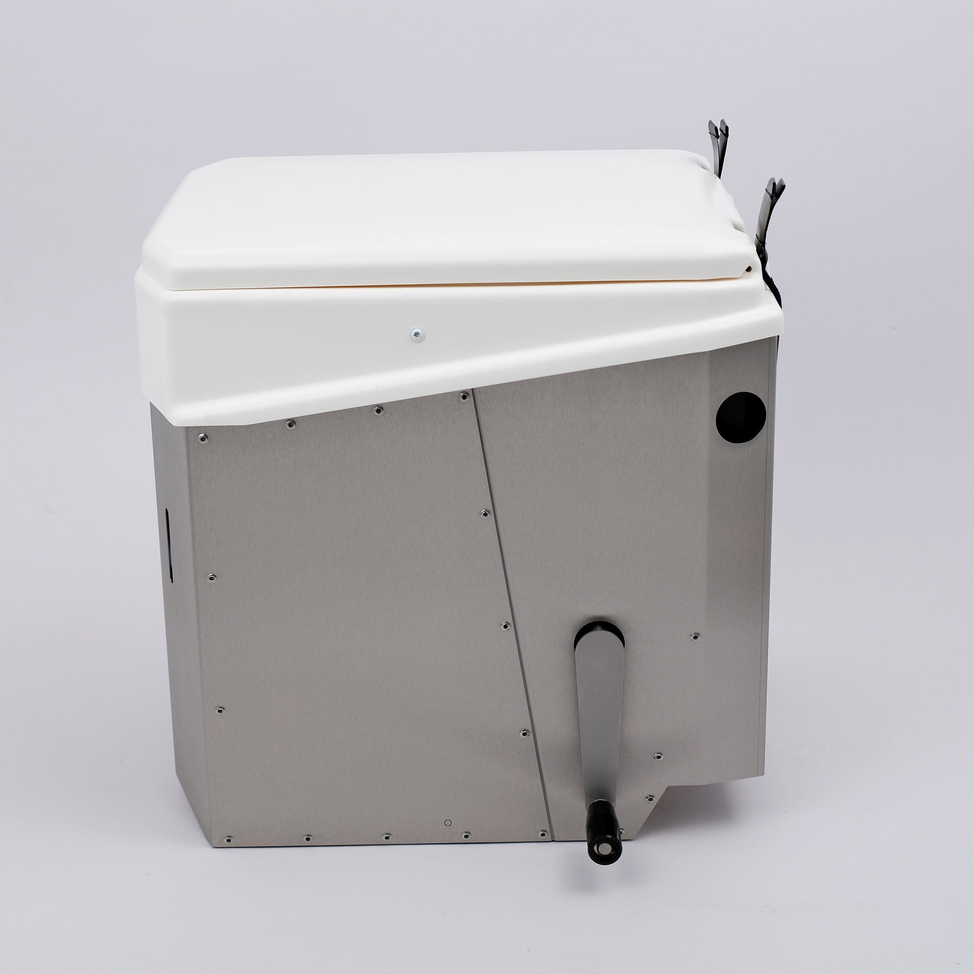 Trockentrenntoilette mit geschlossenem Deckel in der seitlichen Ansicht, robustem Edelstahlgehäuse und kompakter Bauweise.